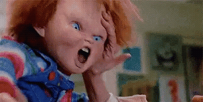 Child's Doll Mouth Open Hand On Head GIF