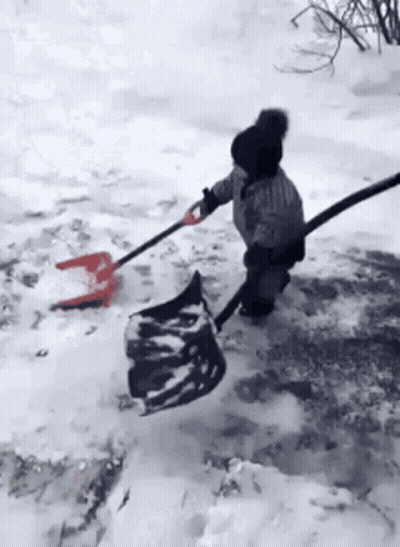 Child Shoveling Snow With Shovel And Hose GIF