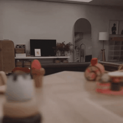 Child Sitting At Table With Toys GIF