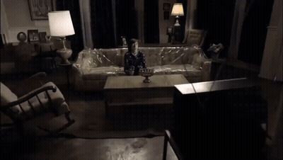 Child Sitting On Couch Covered In Plastic Wrap GIF