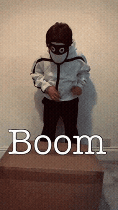 Child Wearing Mask Standing On Boom Box GIF