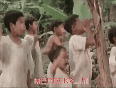 Children Around Tree With Merdeka In Red GIF