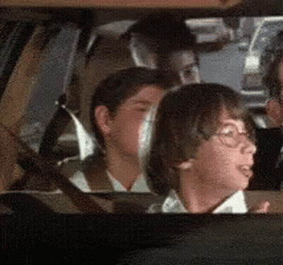 Children Looking Out Car Window GIF