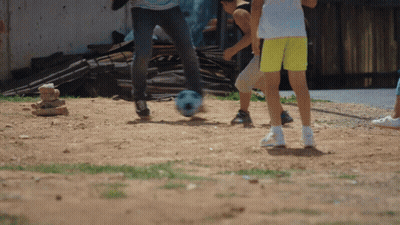 Children Playing Soccer In Dirt GIF