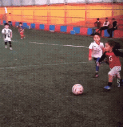Children Playing Soccer Number 6 On Shorts GIF