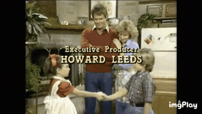 Children Shaking Hands With Man In Kitchen GIF