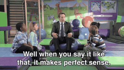 Children Sitting Around Man In Suit GIF