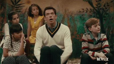 Children Sitting Around Man With Netflix Logo GIF