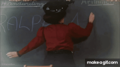 Children Sitting At Desks In Classroom GIF