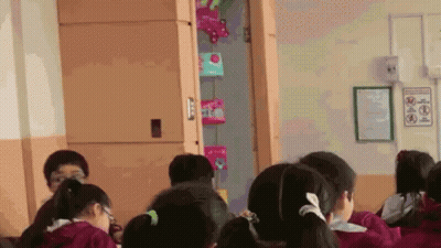 Children Sitting In Classroom With No Smoking Sign GIF