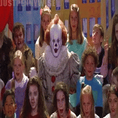 Children Standing In Front Of Clown Costume GIF
