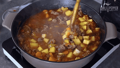 Chili Pepper Stirring Pot Of Stew With Wooden Spoon GIF