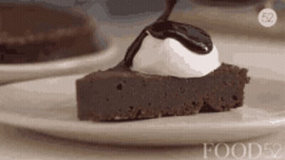 Chocolate Cake With Whipped Cream And Sauce GIF