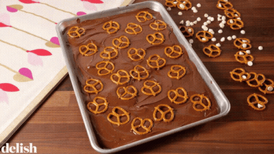 Chocolate Covered Pretzels And Marshmallows Tray Saying Delish GIF