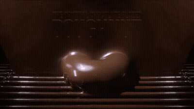 Chocolate Glazed Doughnut Poured Into Tray GIF