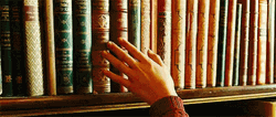 Choosing Books In The Library GIF
