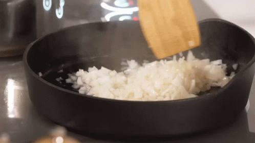 Chopped Onions Stirred With Wooden Spoon GIF
