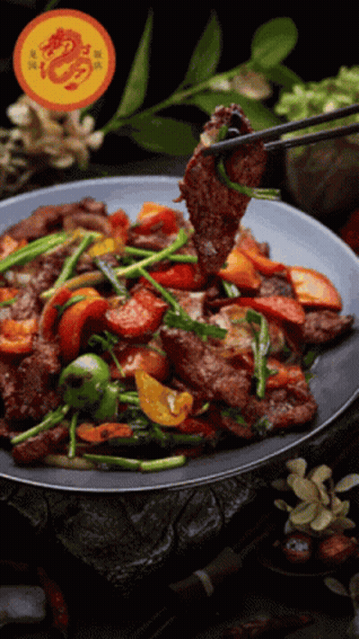 Chopsticks Holding Meat Over Plate Of Food GIF
