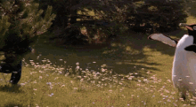 Chris Farley & A Penguin Mascot GIF