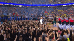 Chris Martin Jumping Of The Crowd GIF