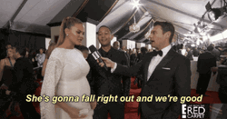 Chrissy Teigen Flexing Pregnant Belly At Red Carpet GIF