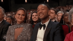 Chrissy Teigen Snickering GIF