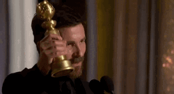 Christian Bale Holding Golden Globe Award GIF