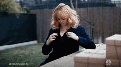 Christina Hendricks Fixing Herself And Do Sexy Postures GIF