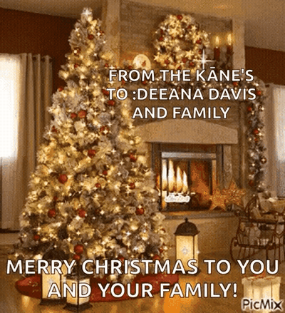 Christmas Card With Christmas Tree In Front Of Fireplace GIF