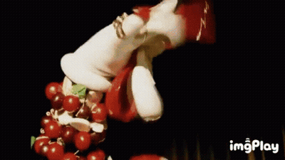 Christmas Wreath With Red Berries And White Hat GIF