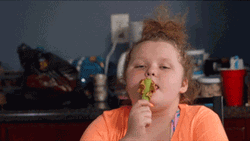 Chubby Girl Licks Peanut Butter On Spoon GIF
