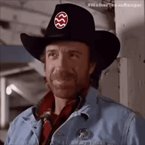 Chuck Norris In Cowboy Hat With Walker Texas Ranger Badge GIF