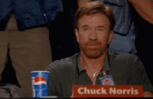 Chuck Norris Is Sitting At A Table With A Cup Of Pepsi GIF