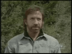 Chuck Norris Thumbs Up Hit Face Oar Unfazed GIF