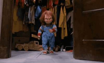 Chucky Doll Sitting On Ladder Holding Stick GIF