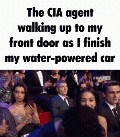 CIA Agent Walking To Front Door While Finishing Water-Powered Car GIF