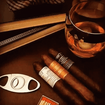Cigar Cutter Next To Cigars GIF