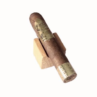 Cigar On Wooden Block Labeled Toro GIF