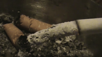 Cigarette Lying In Ashes GIF