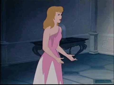 Cinderella Is Standing In A Room Wearing A Pink Dress And A White Skirt . GIF