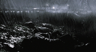 City At Night With Green Light From Sky GIF