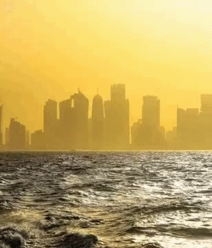 City Skyline Over Water GIF