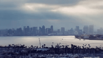 City Skyline With Boats In Water GIF