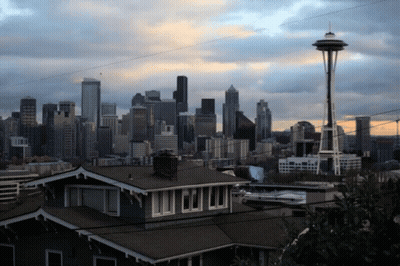 City Skyline With Houses And Space Needle GIF
