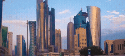 City Skyline With Tall Buildings And Blue Sky GIF
