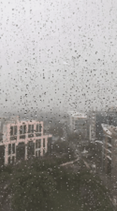 City View Through Rainy Window GIF