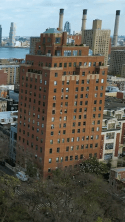 Cityscape Overlooking Lake Ahead GIF