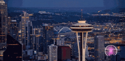 Cityscape With Ferris Wheel And Space Needle GIF