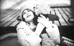 Clara Bow Hugging A Dog GIF