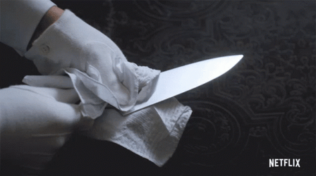 Cleaning A Knife With Tissue Paper GIF